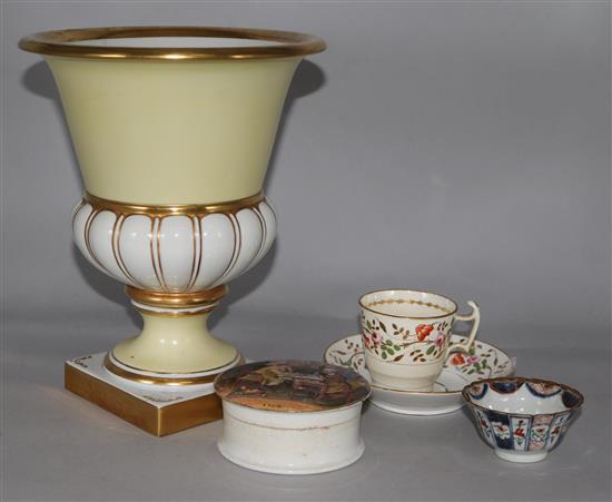 A Portuguese vase, a Rockingham cup and saucer, a tea bowl and saucer and a pot lid and base A Pair